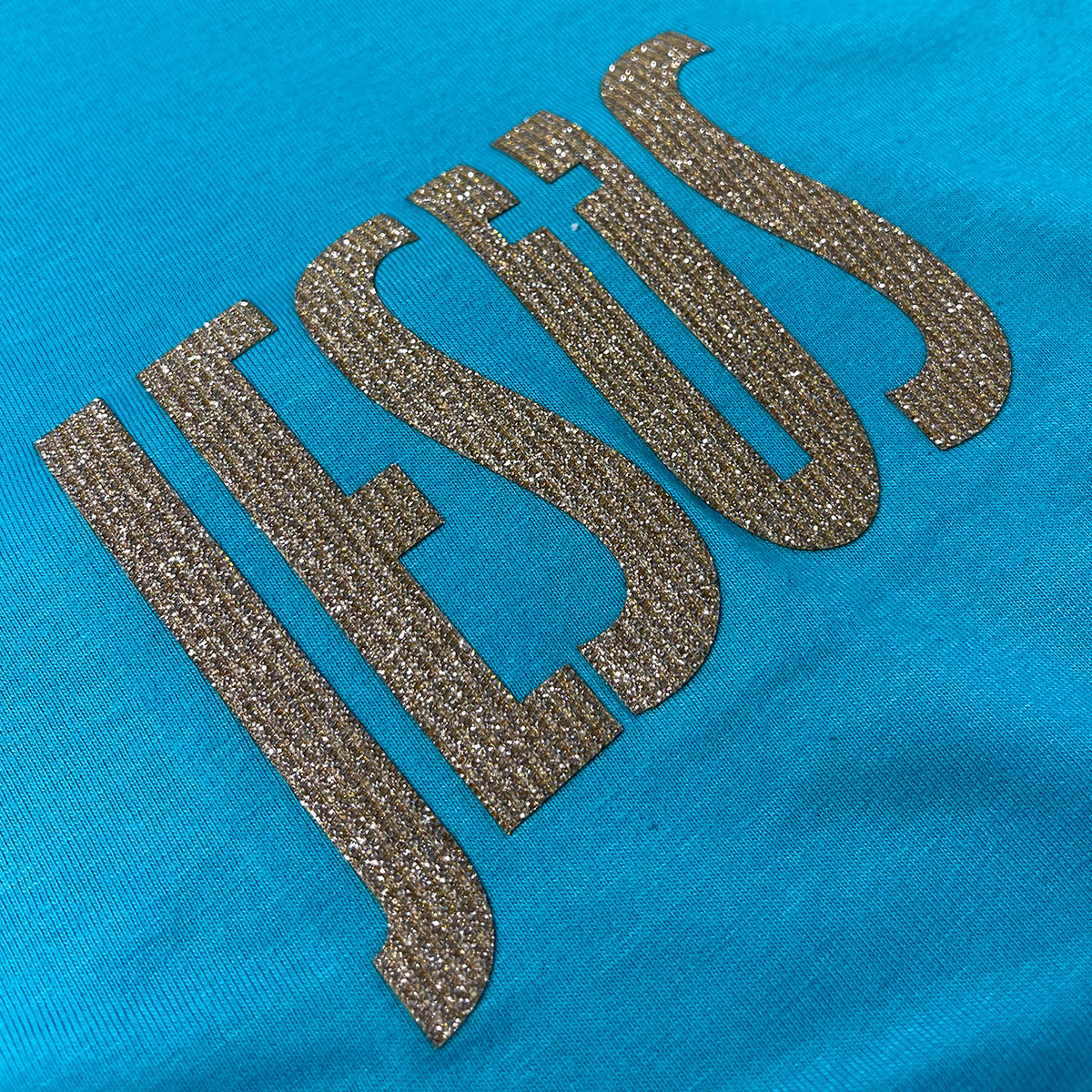 Camiseta Feminina Turquesa Jesus Cruz Glitter